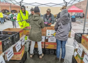 Salt of the Earth volunteers helping neighbors at a food distribution