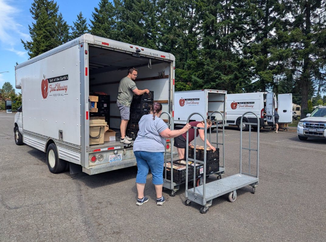Volunteers unloading Salt of the Earth trucks for the Hope Church distribution