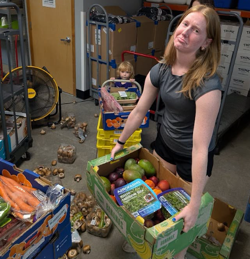 Volunteer with a food box